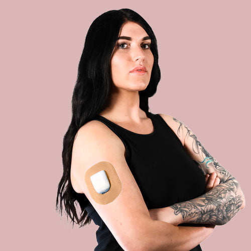 Woman wearing Skin Grip patch on her Omnipod